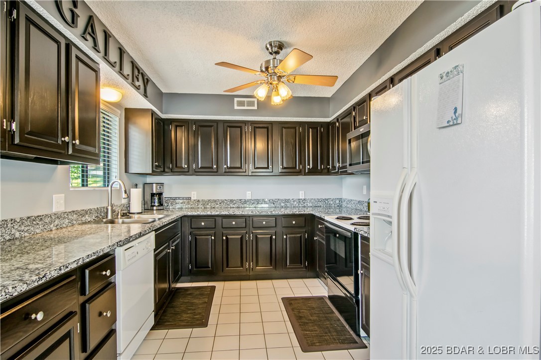 889 Malibu Road, Unit 63 Osage Beach, MO 65065 - Photo 3 of 47 The kitchen has been updated with new counters, pa