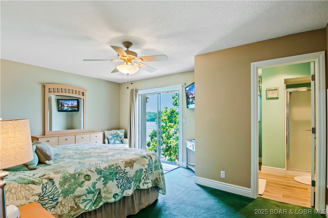 889 Malibu Road, Unit 63 Osage Beach, MO 65065 - Photo 10 of 47 Primary bedroom. Wake up to those striking views