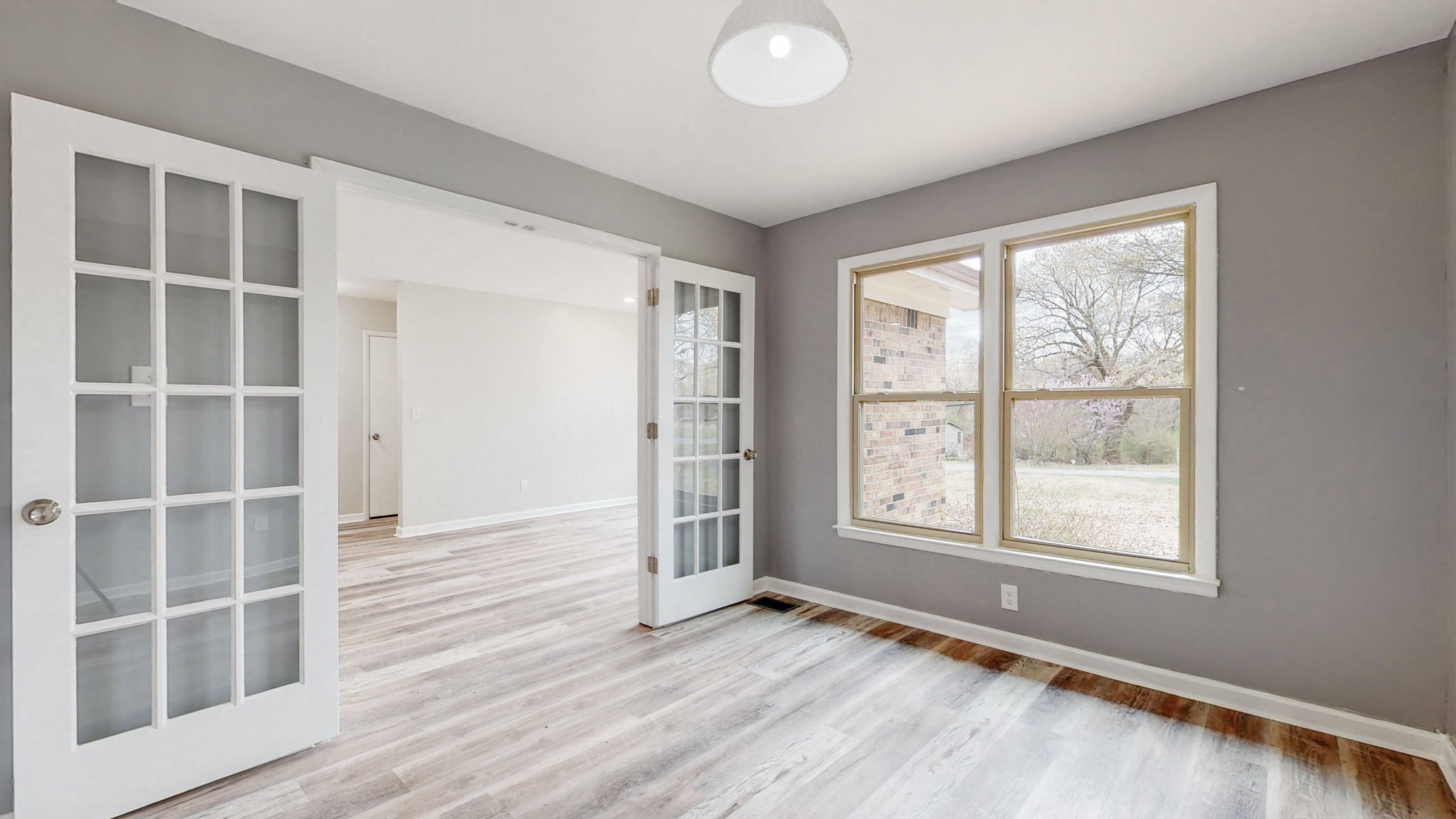 102 East Prospect Road Fayetteville, TN 37334 - Photo 14 of 32 an empty room with wooden floor and windows