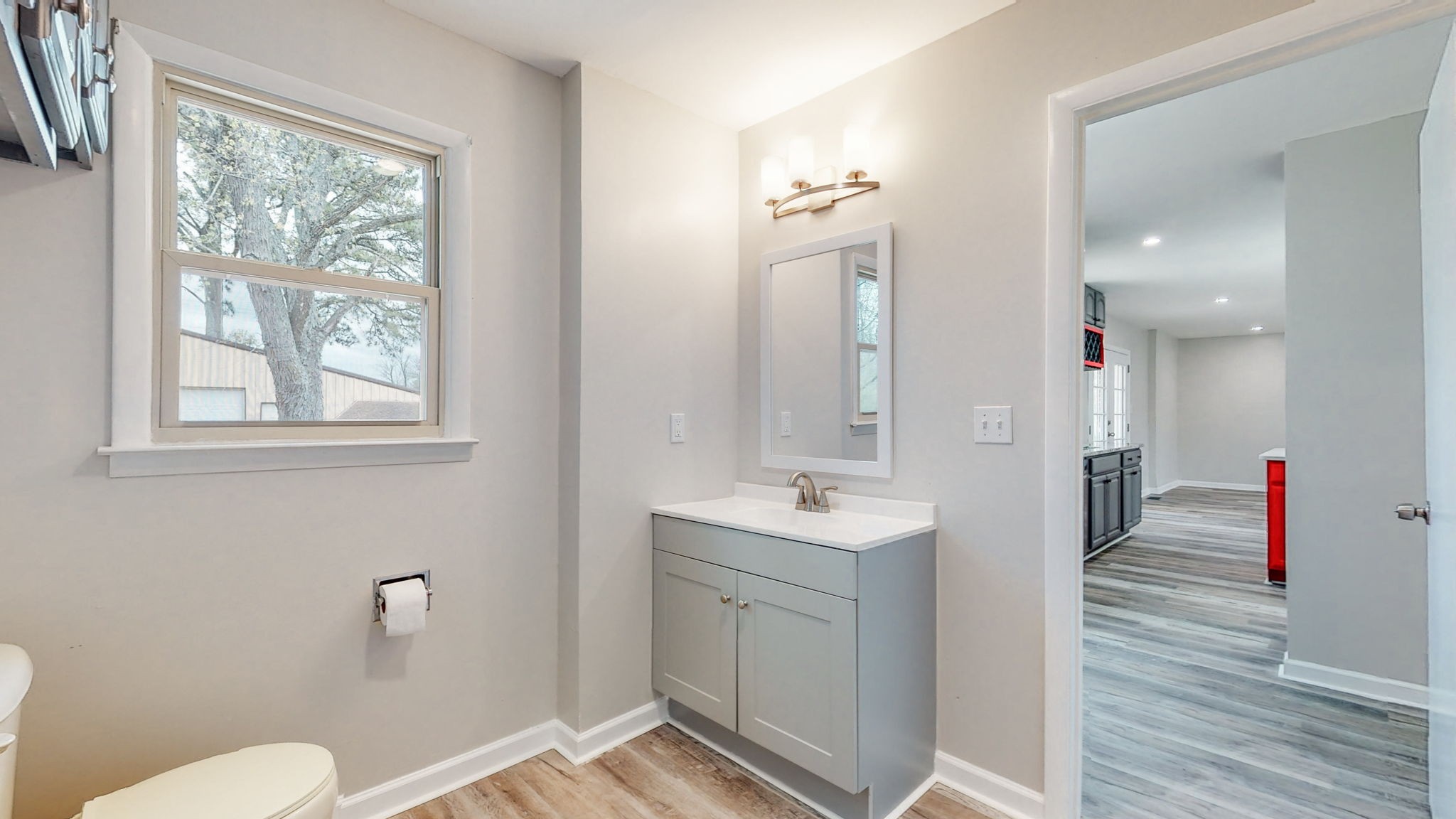 102 East Prospect Road Fayetteville, TN 37334 - Photo 17 of 32 a bathroom with a toilet a sink and mirror