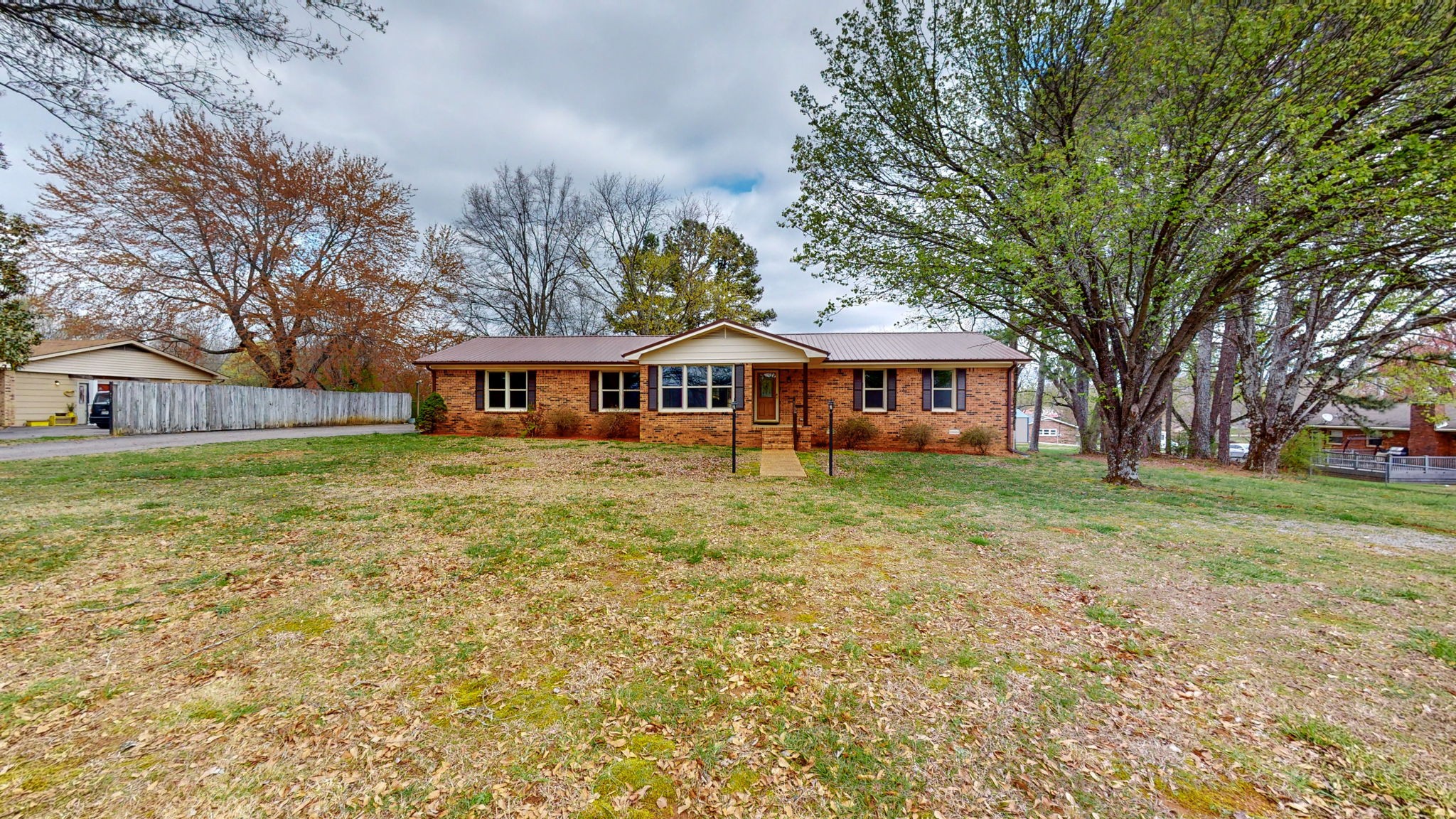 102 East Prospect Road Fayetteville, TN 37334 - Photo 32 of 32 a front view of a house with a garden and trees