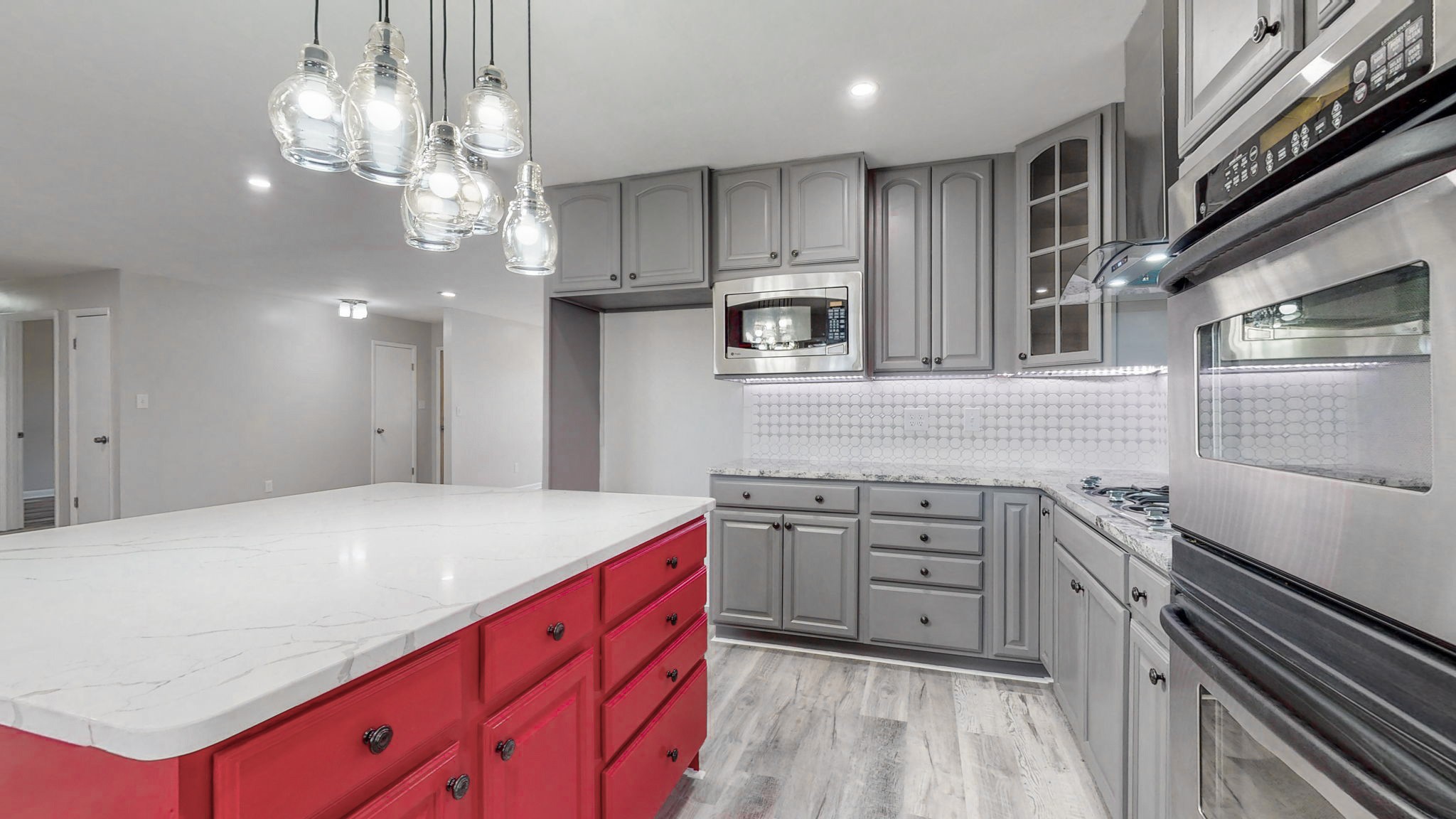 102 East Prospect Road Fayetteville, TN 37334 - Photo 6 of 32 a kitchen with white cabinets a sink dishwasher and a stove with wooden floor