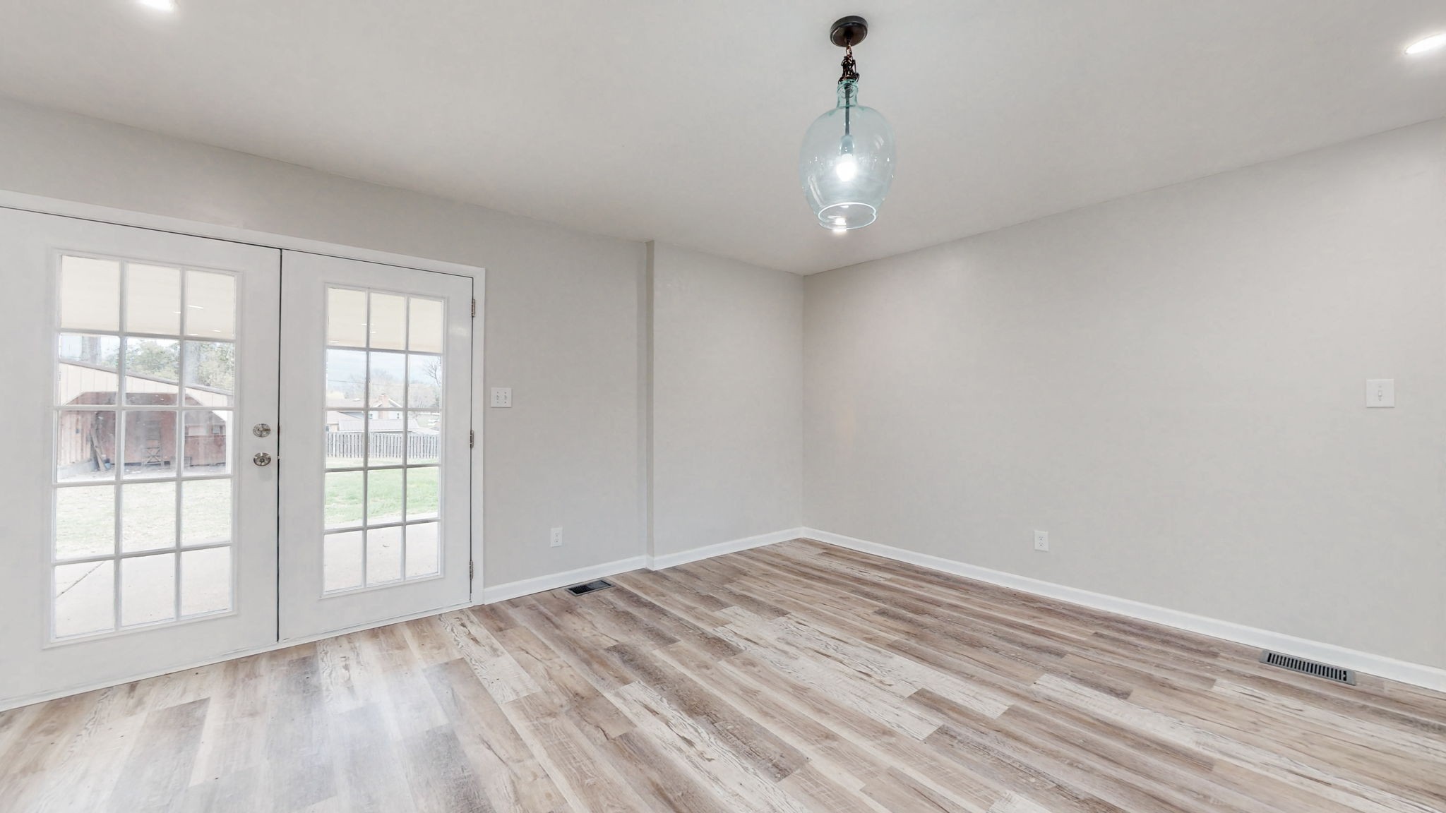 102 East Prospect Road Fayetteville, TN 37334 - Photo 10 of 32 an empty room with wooden floor and windows