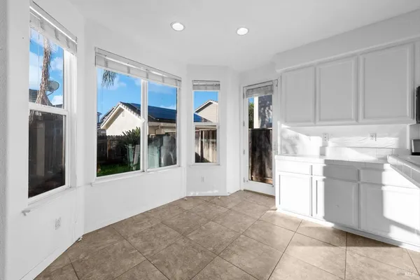 a view of living room with furniture and a flat screen tv