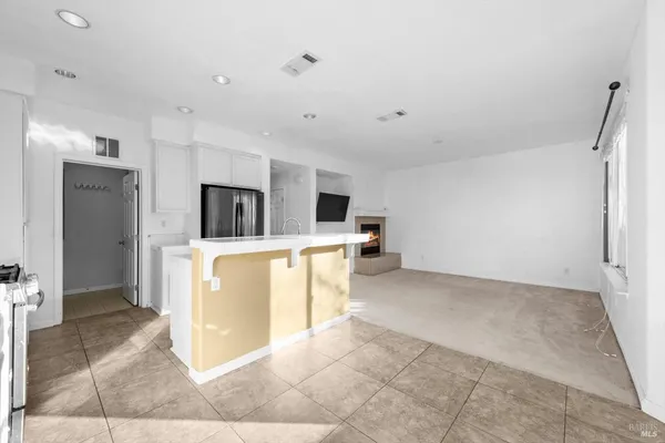 a view of a big room with windows and entryway