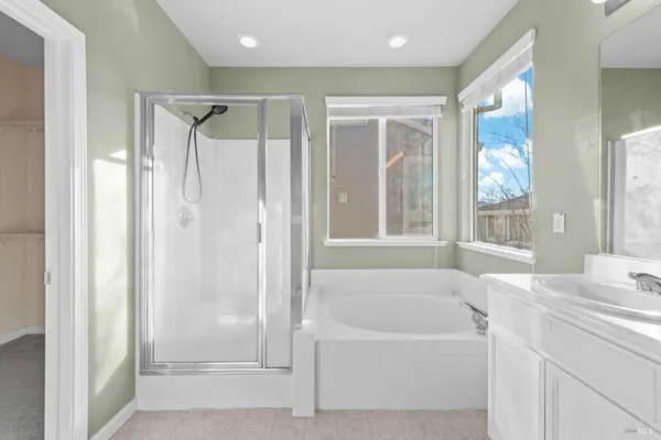 a bathroom with a shower a toilet and a sink