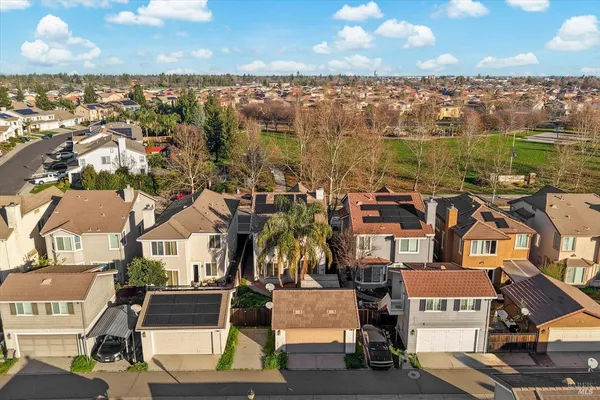 an aerial view of a house with a garden
