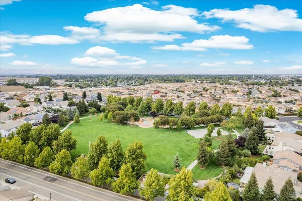 an aerial view of a house with a yard and garden