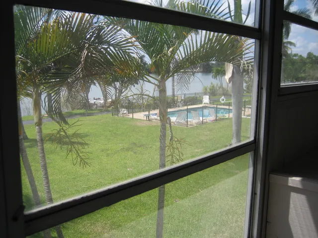 a view of swimming pool from a window