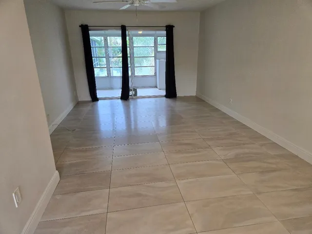 a view of an empty room with a window