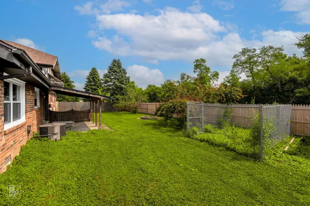 a backyard of a house with lots of green space