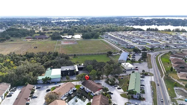 an aerial view of a house with a lake view