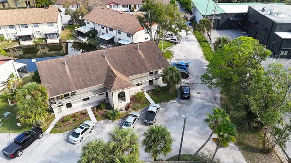 an aerial view of multiple houses with yard