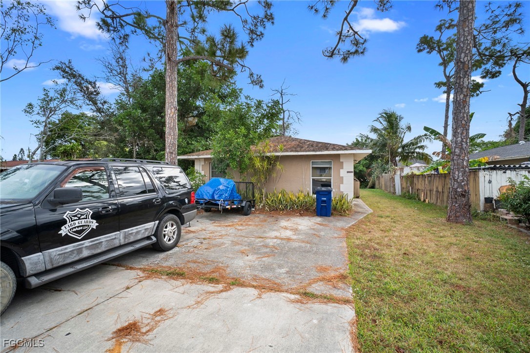 5449 Tenth Avenue Fort Myers, FL 33907 - Photo 1 of 18 a view of a car in front of house