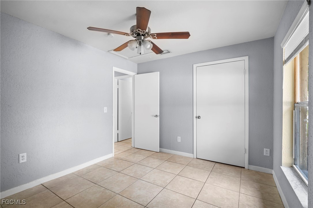 5449 Tenth Avenue Fort Myers, FL 33907 - Photo 12 of 18 a view of an empty room and window