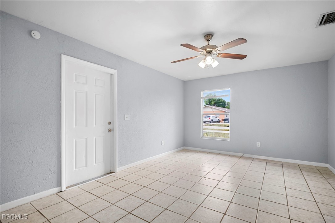 5449 Tenth Avenue Fort Myers, FL 33907 - Photo 5 of 18 a view of an empty room and window