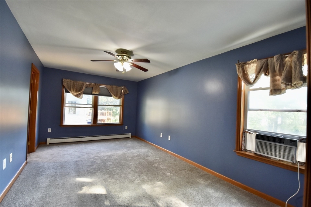 375 Thompson Road Webster, MA 01570 - Photo 12 of 21 wooden floor in an empty room with a window
