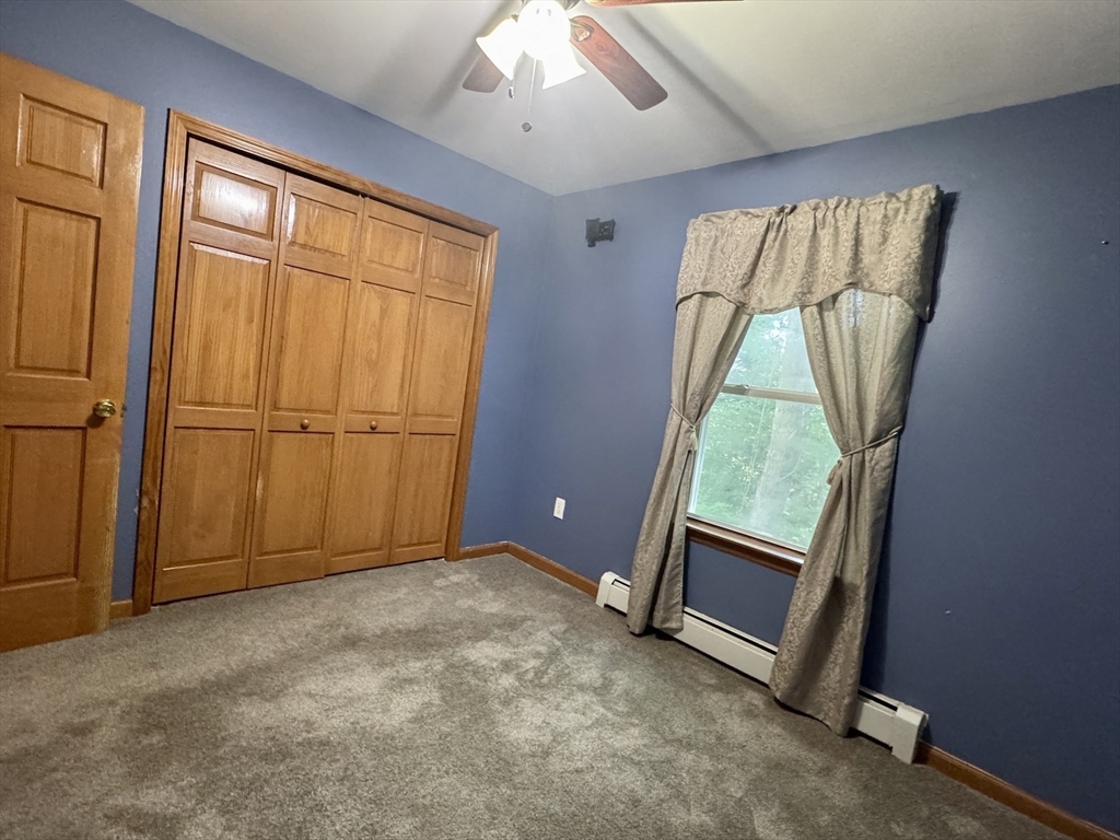 375 Thompson Road Webster, MA 01570 - Photo 17 of 21 an empty room with windows