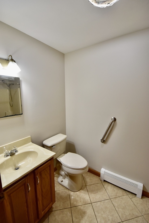 375 Thompson Road Webster, MA 01570 - Photo 18 of 21 a bathroom with a sink a toilet and mirror