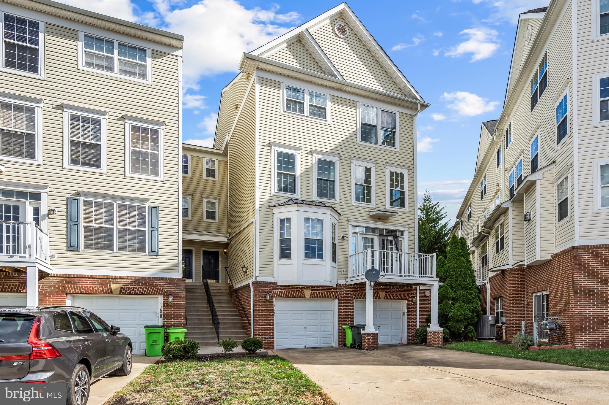 13600 Salk Street, Unit 131 Herndon, VA 20171 - Photo 1 of 34 a front view of a residential apartment building with a yard