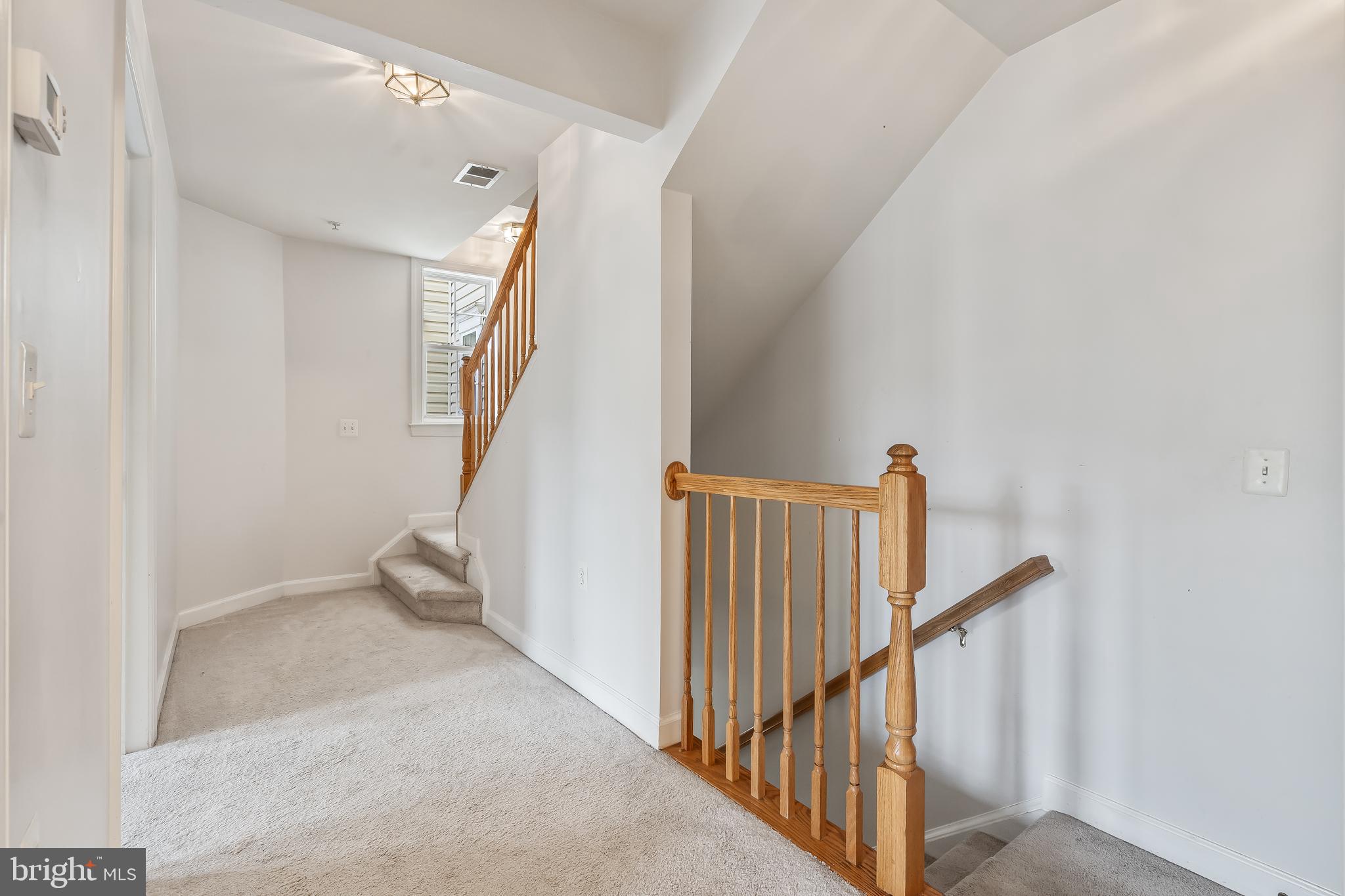 13600 Salk Street, Unit 131 Herndon, VA 20171 - Photo 17 of 34 a view of a hallway with staircase
