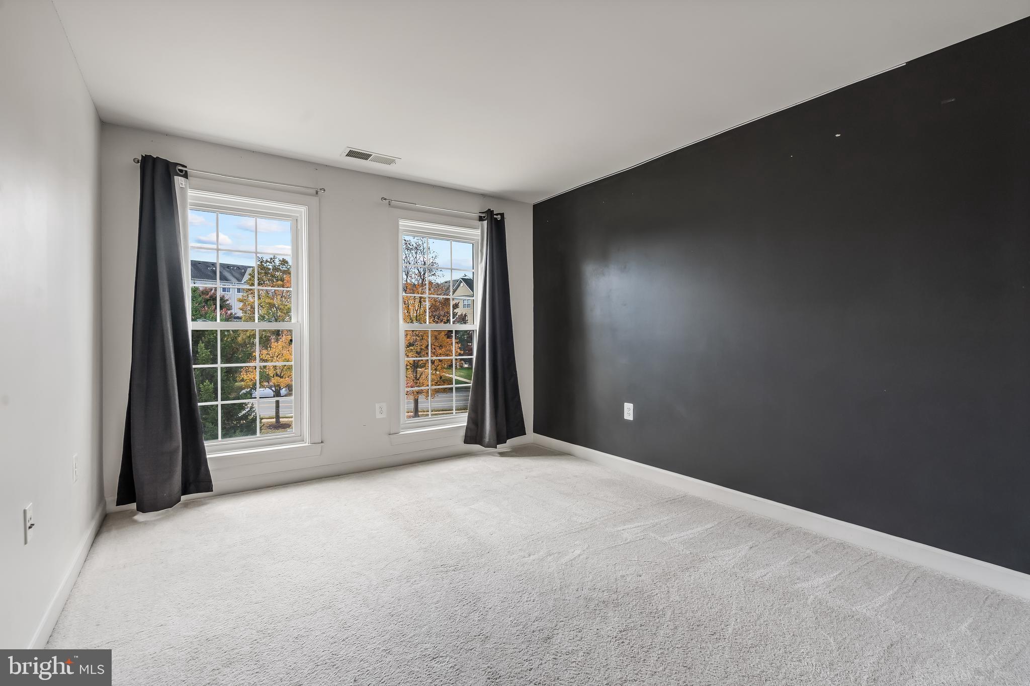 13600 Salk Street, Unit 131 Herndon, VA 20171 - Photo 30 of 34 a view of an empty room with a window