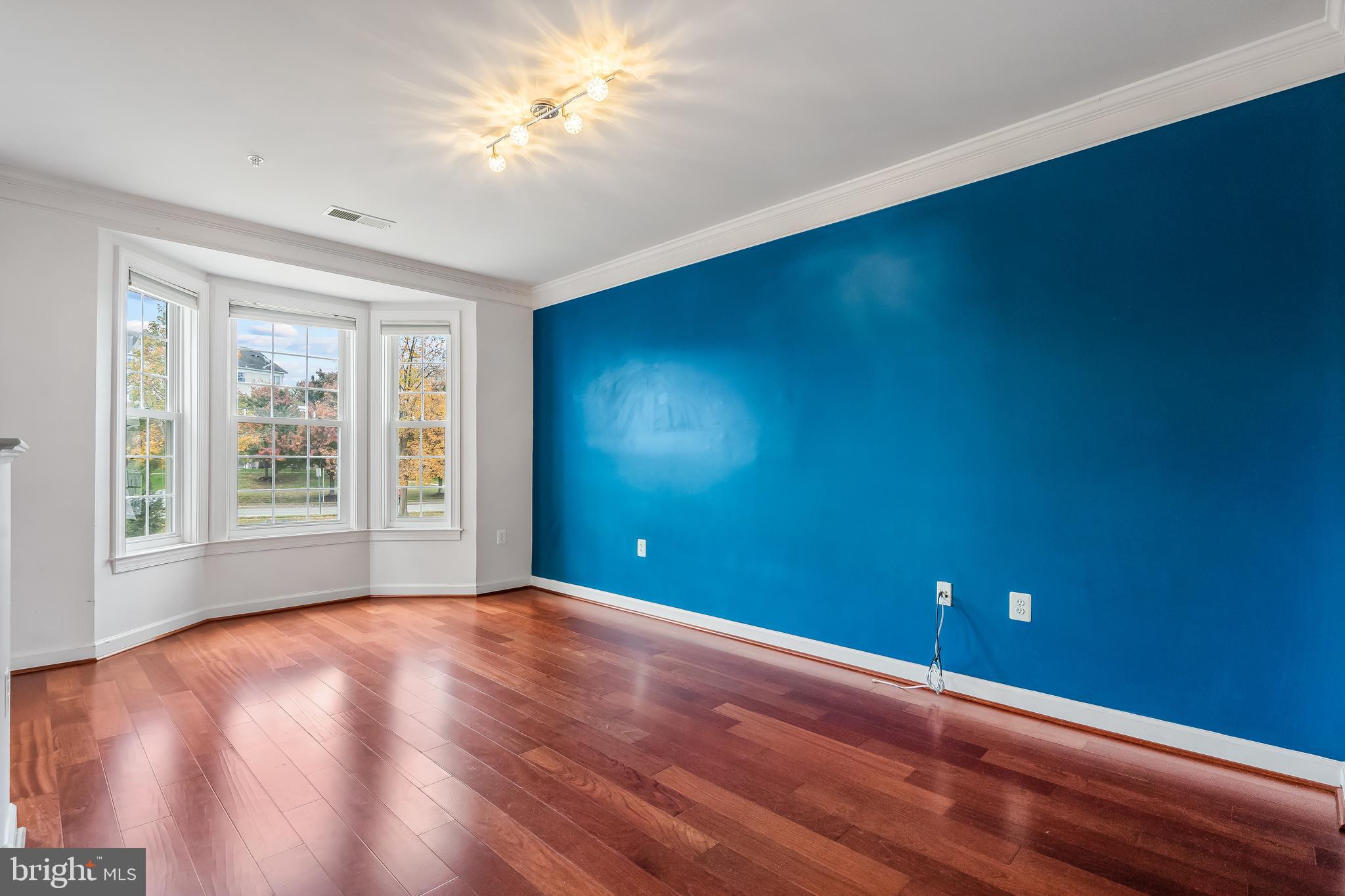 13600 Salk Street, Unit 131 Herndon, VA 20171 - Photo 10 of 34 a view of empty room with window and ceiling fan