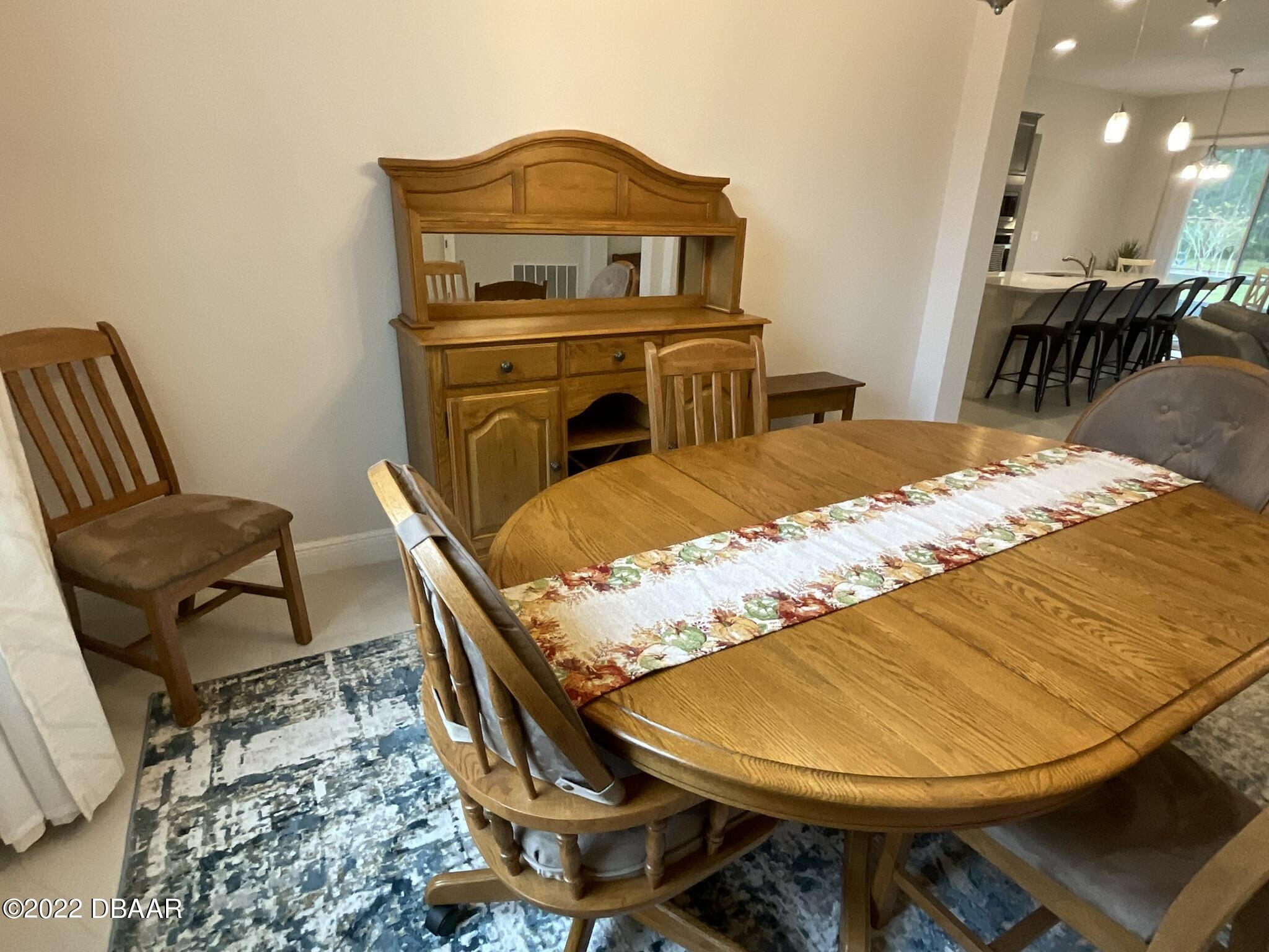283 Cypress Trail Drive Ormond Beach, FL 32174 - Photo 14 of 28 a view of a dining room with furniture