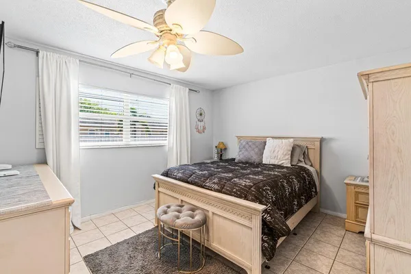 a bedroom with a bed and a table in it