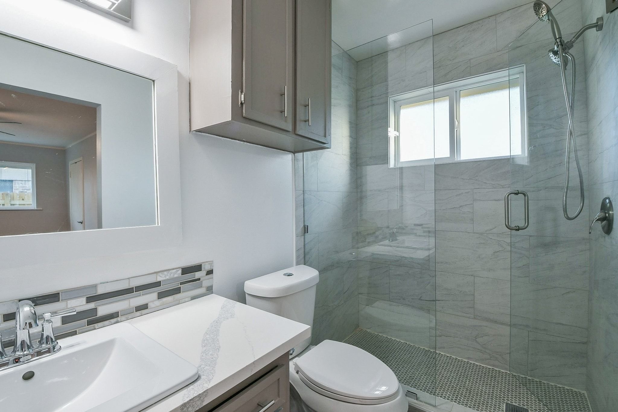 9111 Rentur Drive Houston, TX 77031 - Photo 18 of 21 a bathroom with a sink a toilet and shower