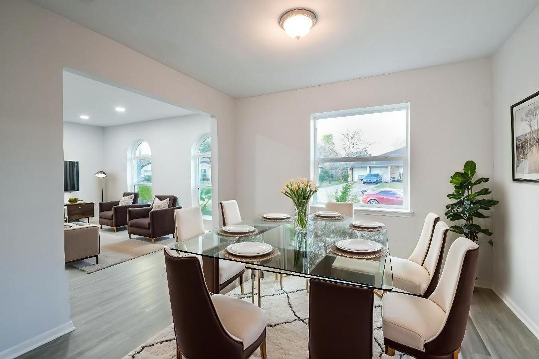 9111 Rentur Drive Houston, TX 77031 - Photo 3 of 21 a view of a dining room with furniture window and wooden floor