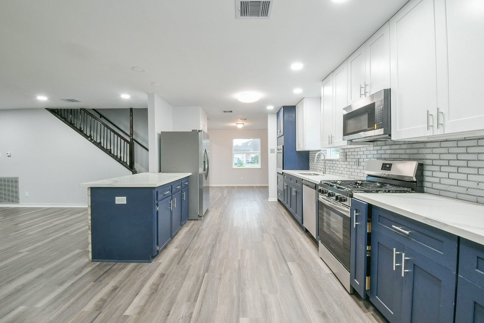 9111 Rentur Drive Houston, TX 77031 - Photo 6 of 21 a kitchen with stainless steel appliances granite countertop a refrigerator a sink dishwasher a stove and a oven with wooden cabinets