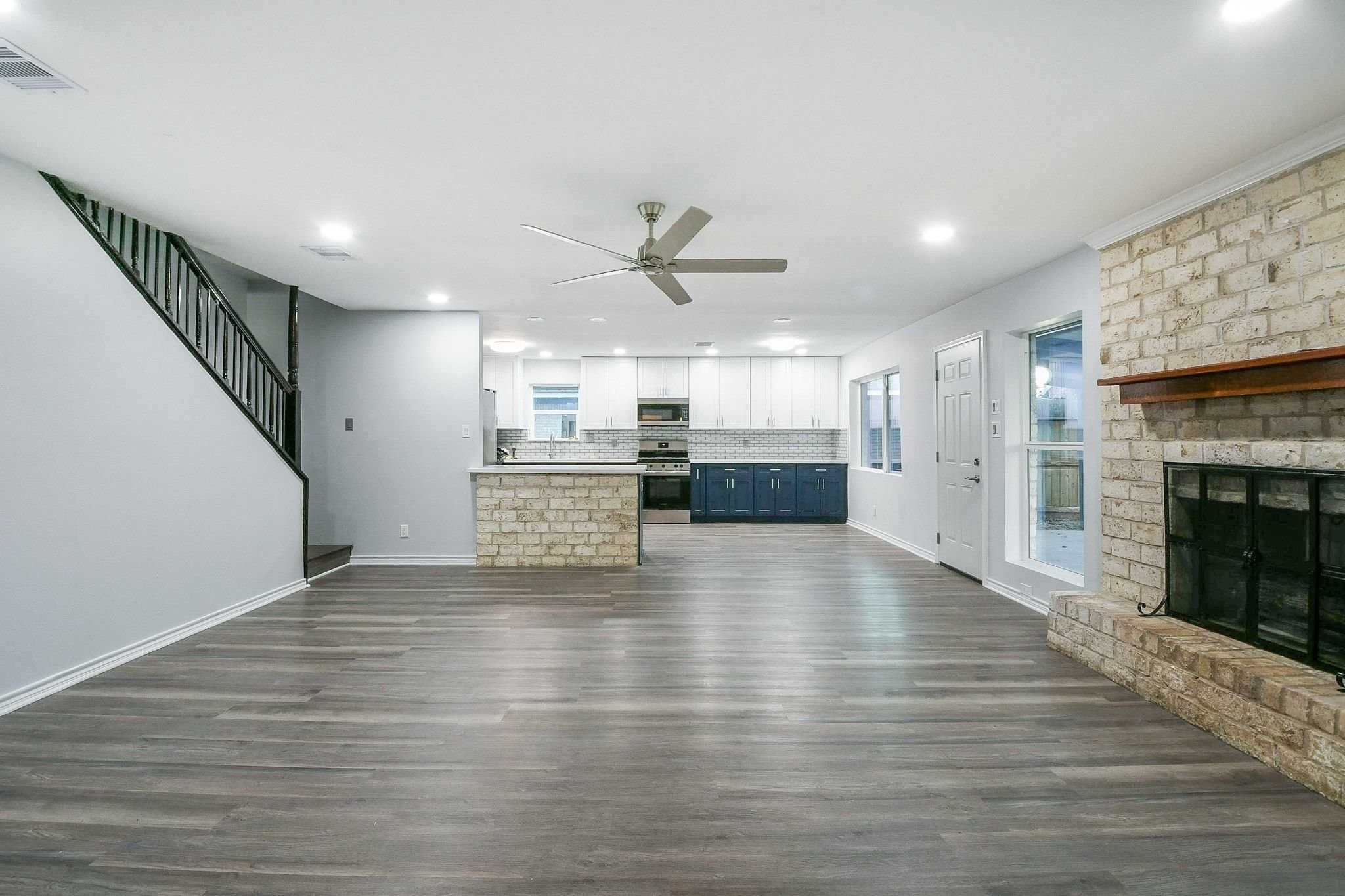9111 Rentur Drive Houston, TX 77031 - Photo 10 of 21 a view of a kitchen with a sink and a fireplace