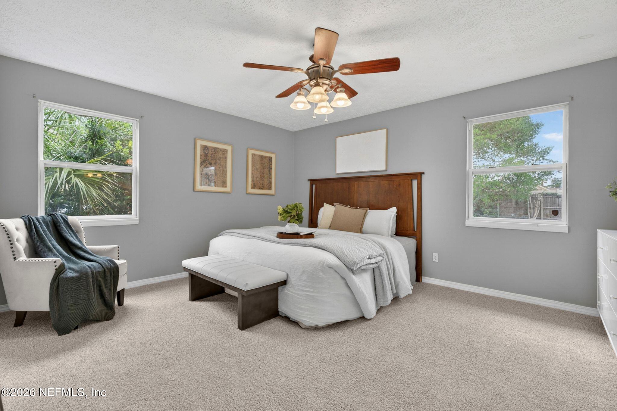 138 Ridgefield Court Orange Park, FL 32065 - Photo 30 of 64 a bedroom with a bed and a window