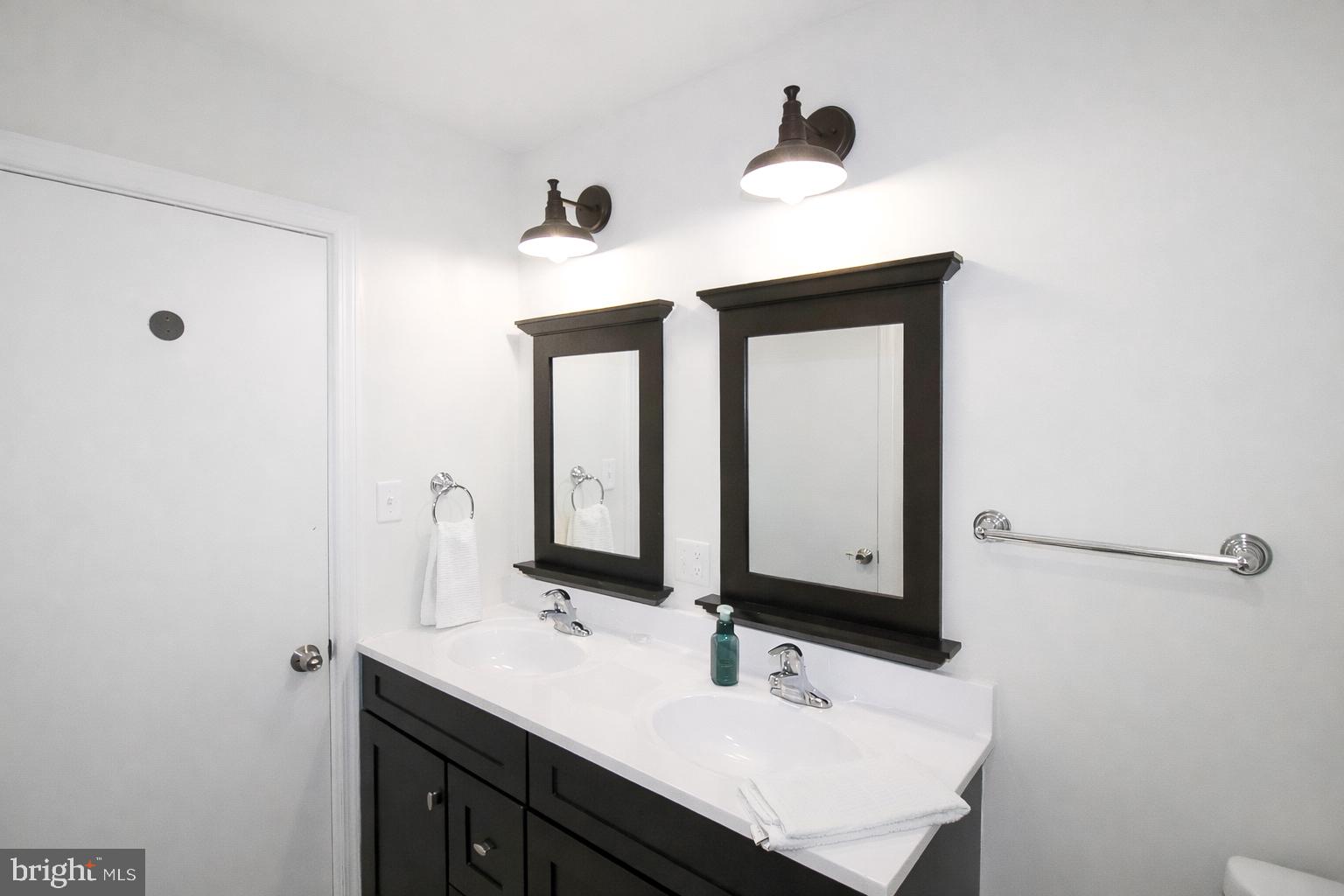 416 North Duke Street Hummelstown, PA 17036 - Photo 12 of 26 a bathroom with a sink vanity and mirror