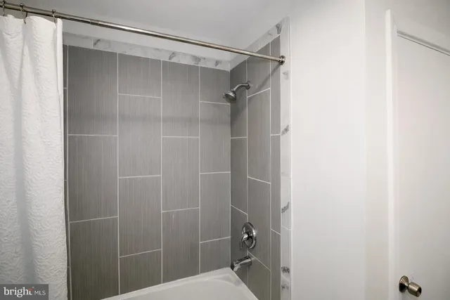 a bathroom with a shower and a toilet