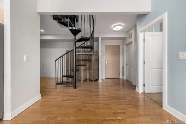 a view of entryway with stairs and wooden floor