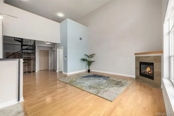 a view of a kitchen with a sink and a fireplace