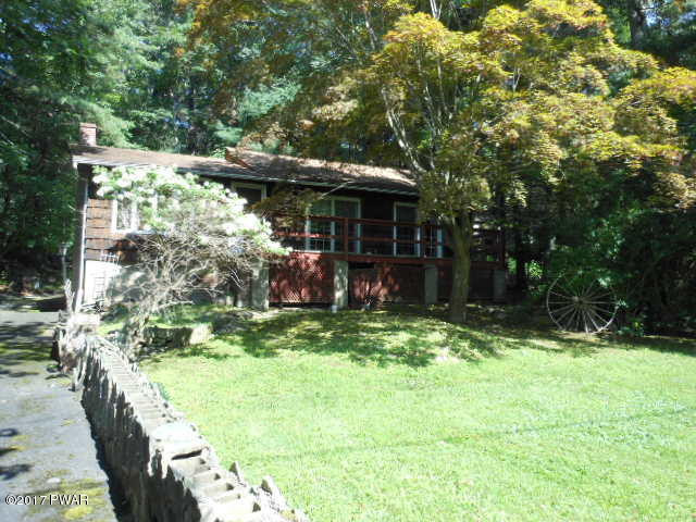 207 Aspen Road Dingmans Ferry, PA 18328 - Photo 2 of 22 a view of a couches in backyard of house