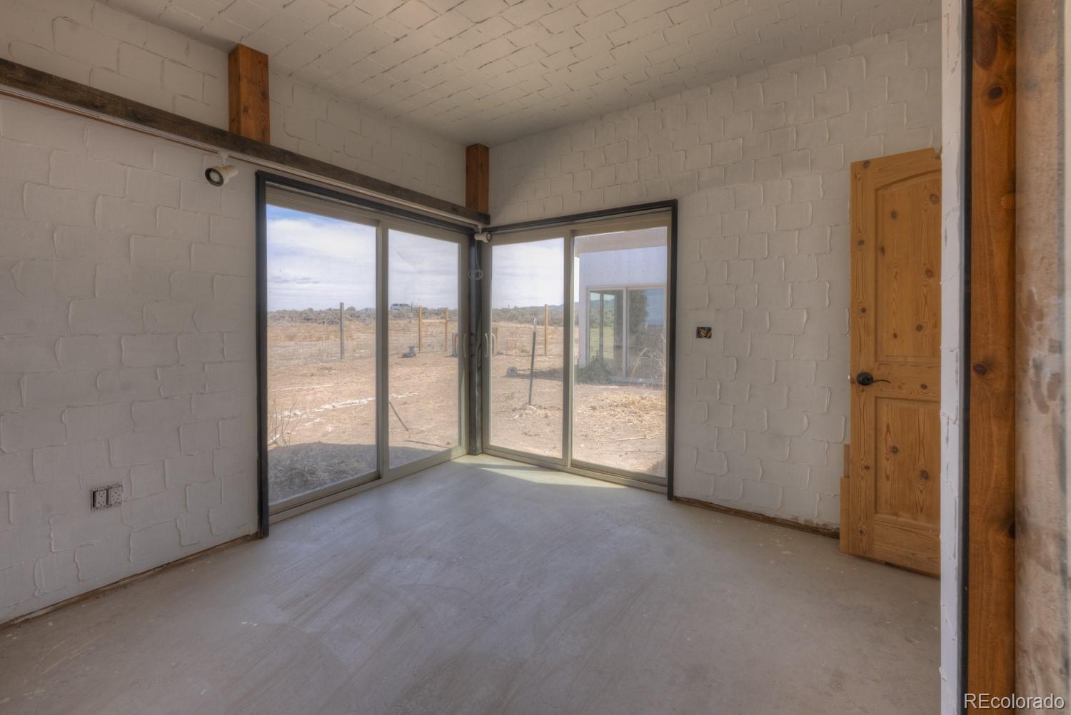 6592 Slegers Road Fort Garland, CO 81133 - Photo 19 of 30 a view of an empty room and window