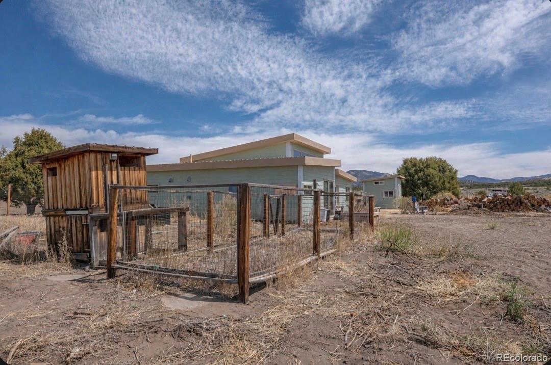 6592 Slegers Road Fort Garland, CO 81133 - Photo 25 of 30 a view of a house with a yard