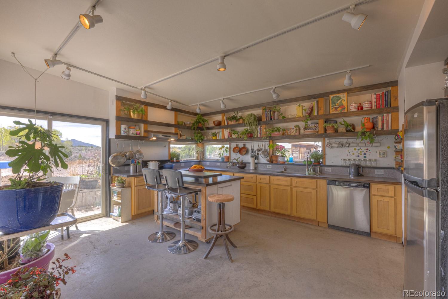6592 Slegers Road Fort Garland, CO 81133 - Photo 7 of 30 a kitchen with sink cabinets and window