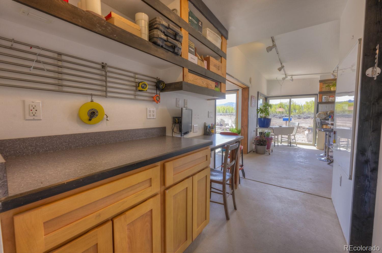 6592 Slegers Road Fort Garland, CO 81133 - Photo 9 of 30 a kitchen with a sink a counter top space and appliances