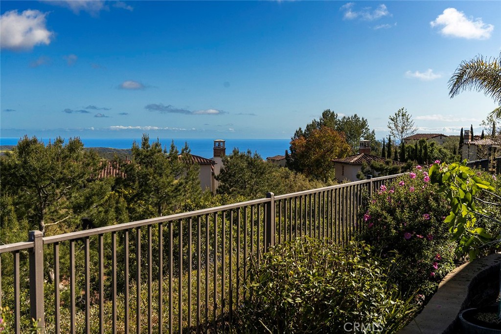 a view of a balcony with wooden floor and city view