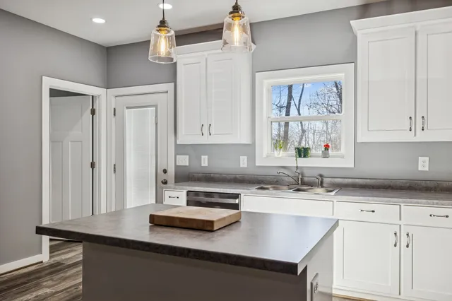 a bathroom with a toilet a sink and a shower