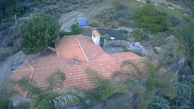 an aerial view of a house with outdoor space