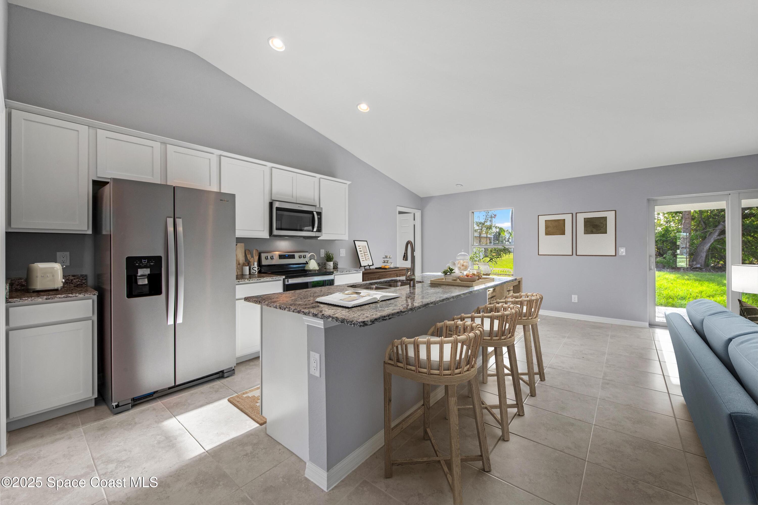 311 La Croix Road Southwest Palm Bay, FL 32908 - Photo 6 of 15 SL_CayoCosta_Kitchen-Dining