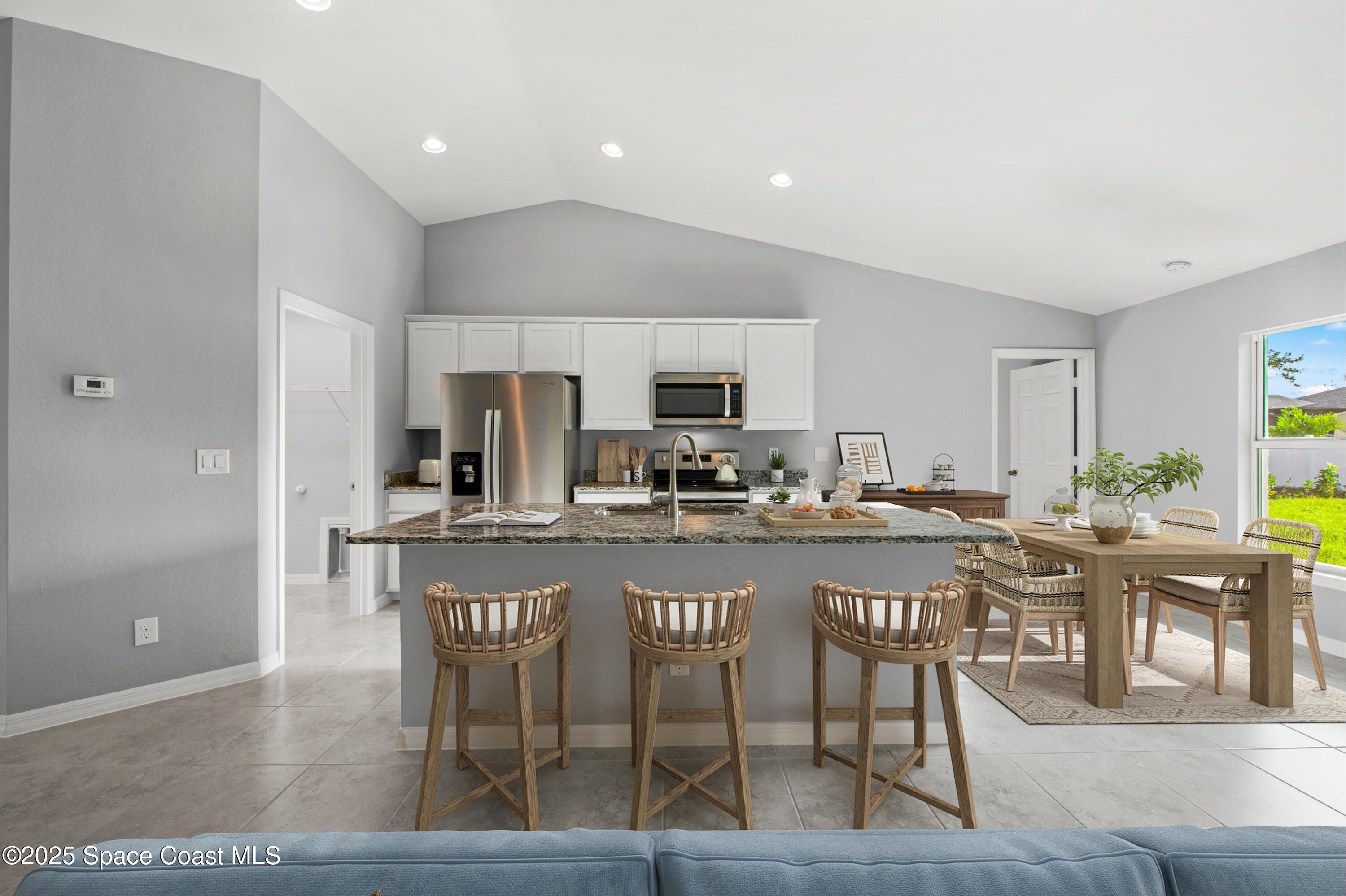 311 La Croix Road Southwest Palm Bay, FL 32908 - Photo 7 of 15 SL_CayoCosta_Kitchen-Dining1