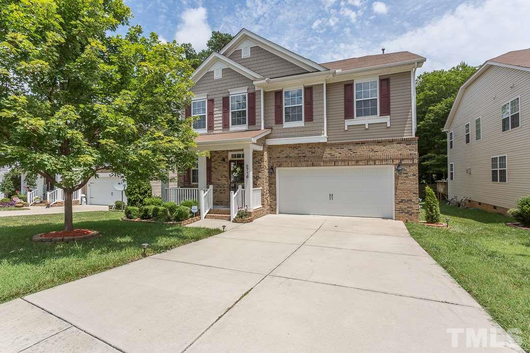 5716 Sea Fox Court Raleigh, NC 27616 - Photo 1 of 23 front view of house with a yard