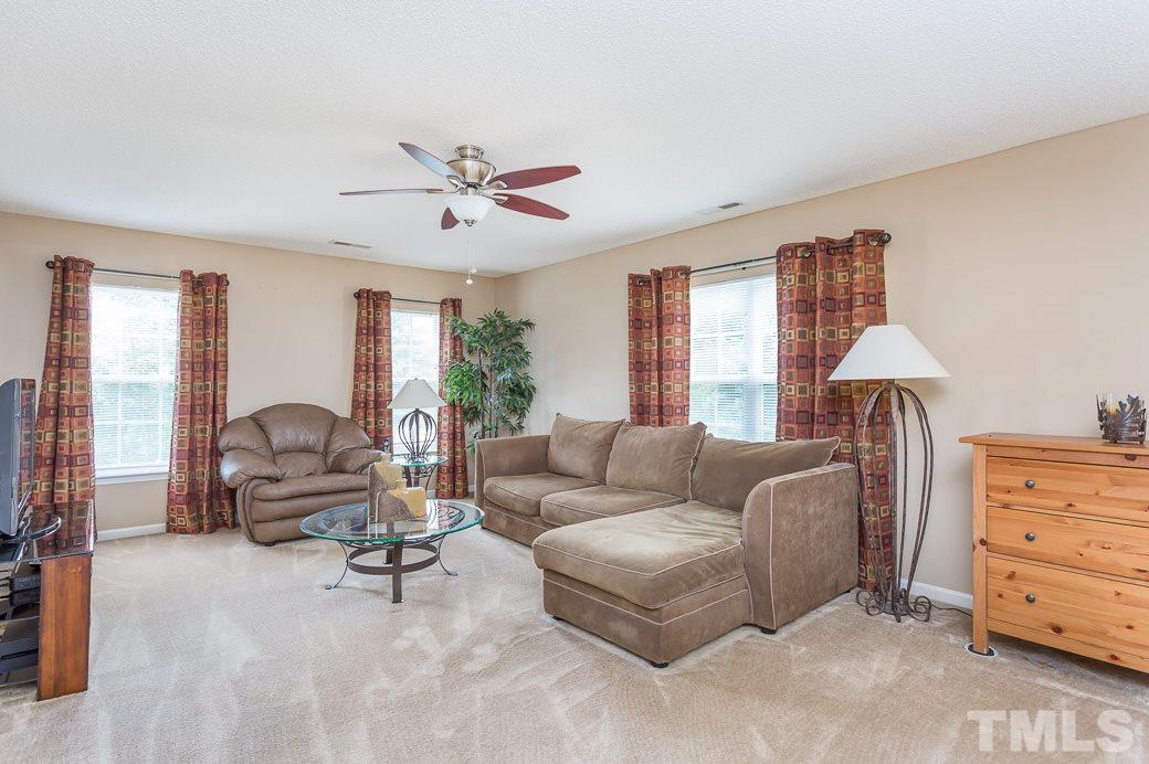 5716 Sea Fox Court Raleigh, NC 27616 - Photo 11 of 23 a living room with furniture and a window
